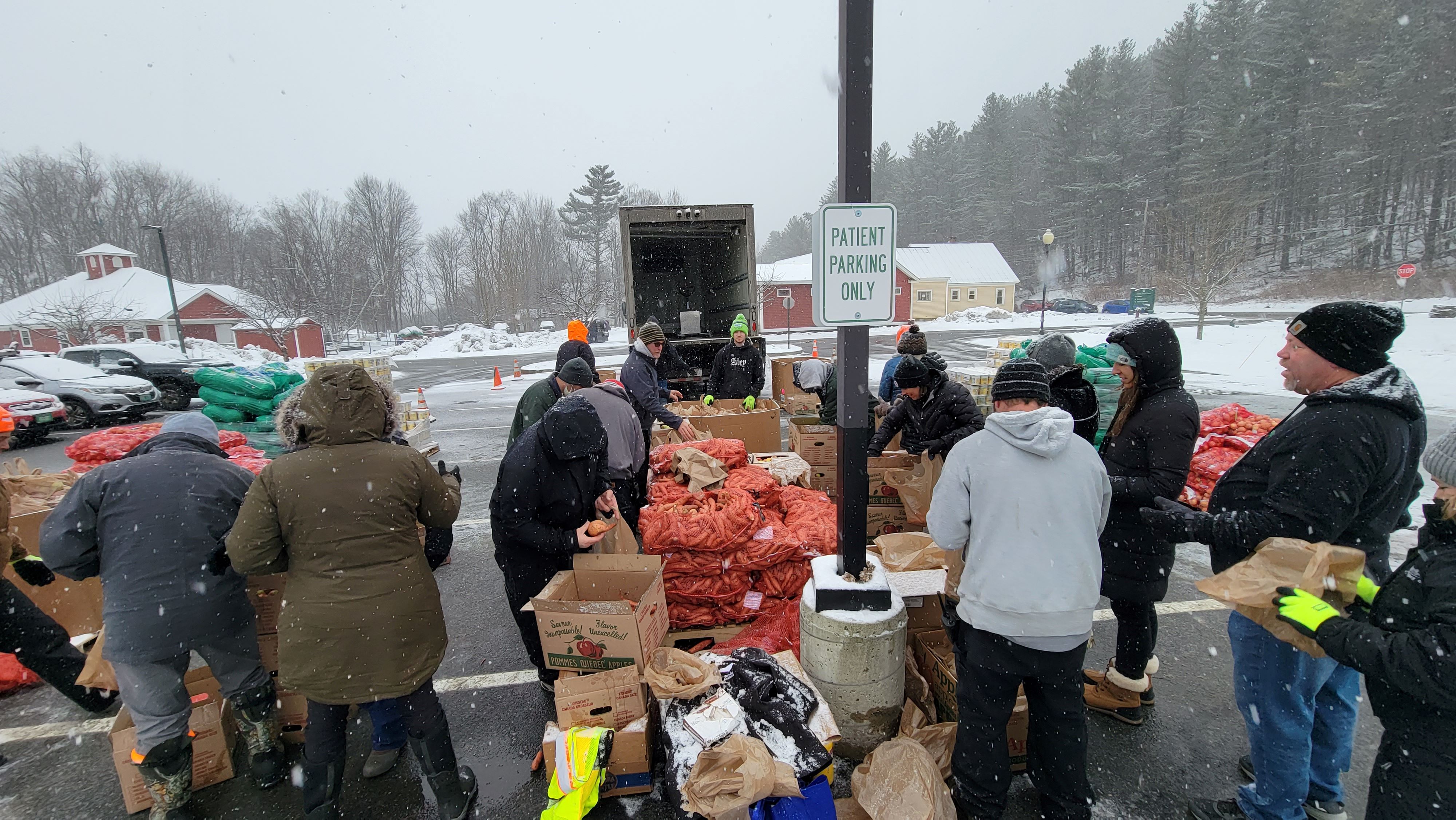 several people serving food outside