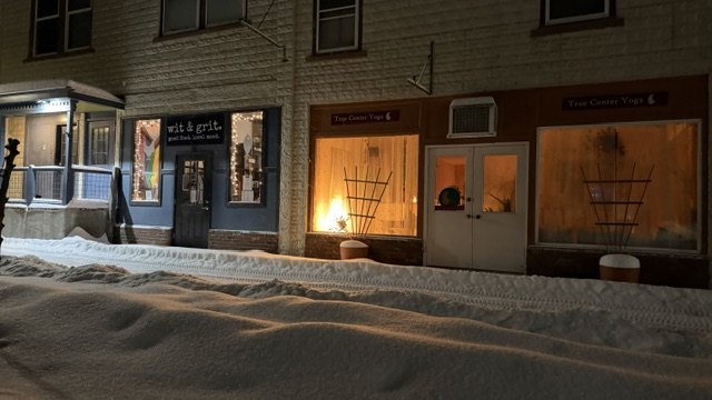 outside the yoga studio w snow on the sidewalk