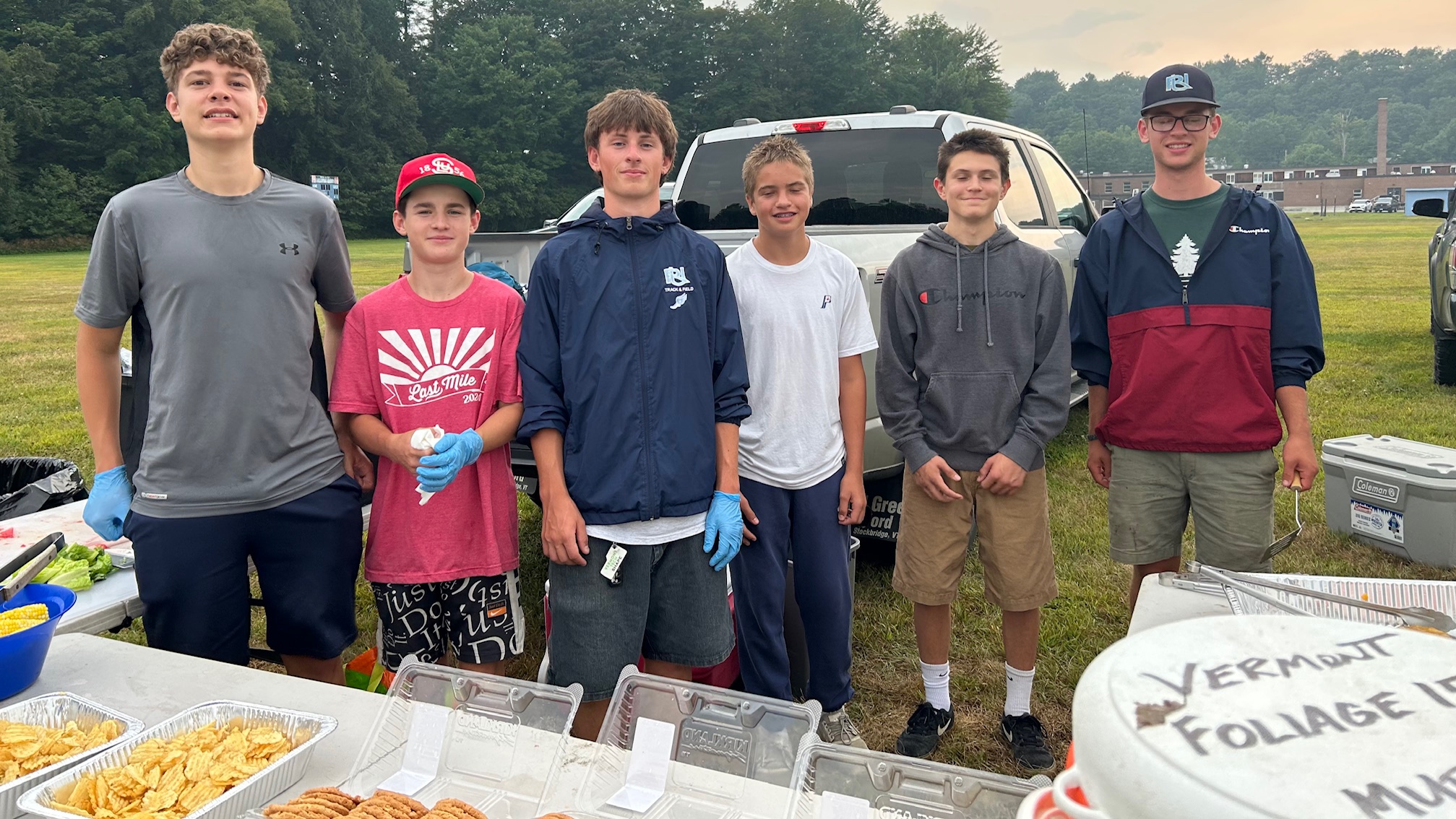 teens grilling at a soccer game