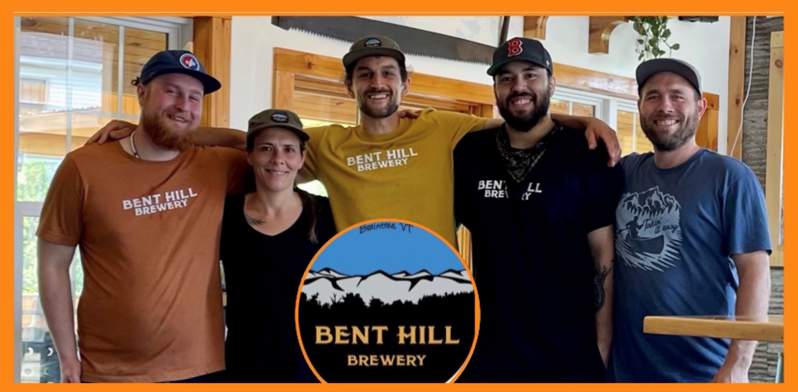 four poeple smiling at a micro brewery