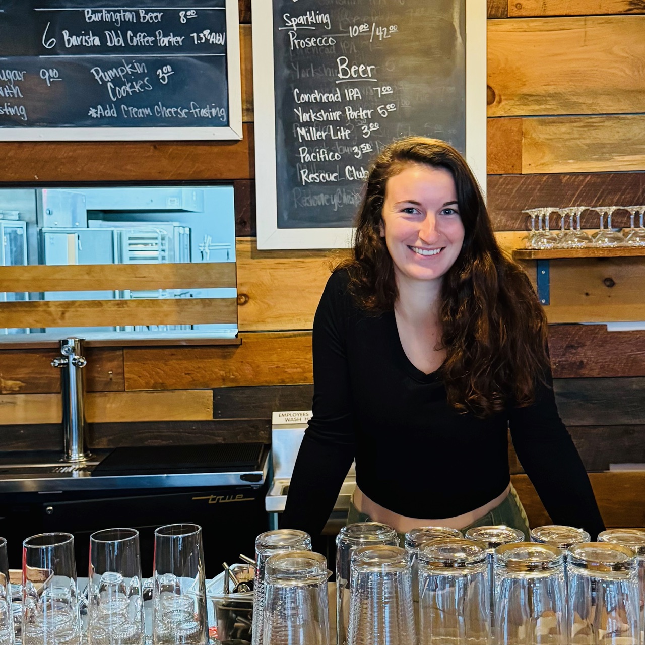 business owner, female, smiling in her restaurant