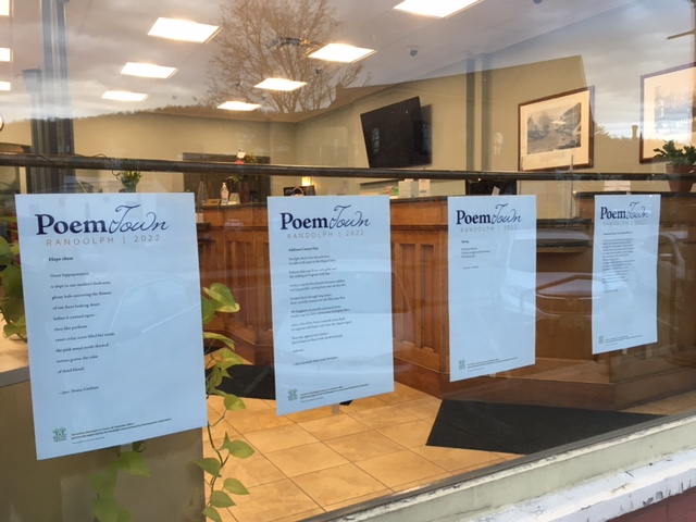 poems hanging in a window