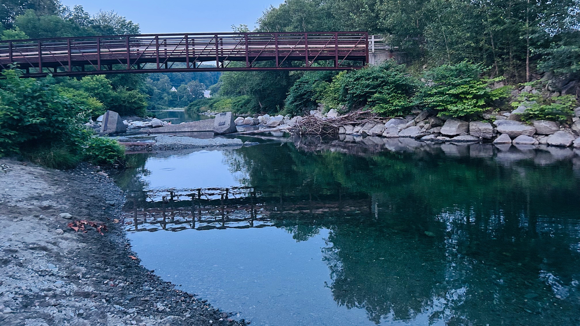 river w a foot bridge